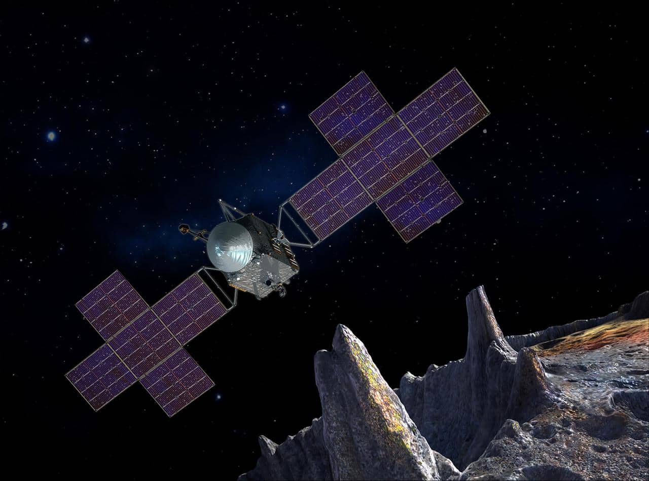 Concept artistico della sonda NASA Psyche con i suoi pannelli solari estesi in viaggio verso l'asteroide metallico